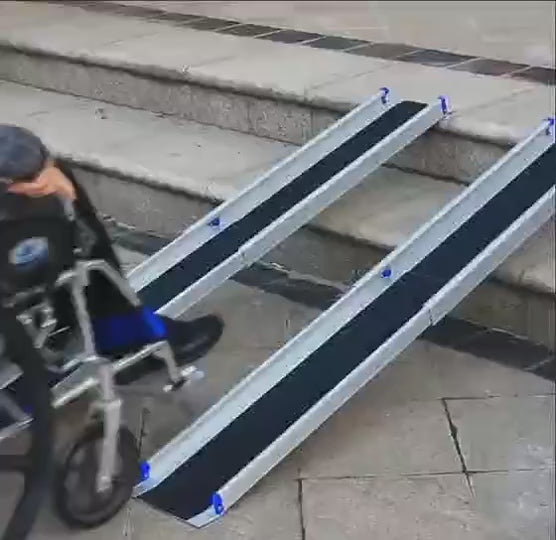 Folding wheelchair clearance ramps